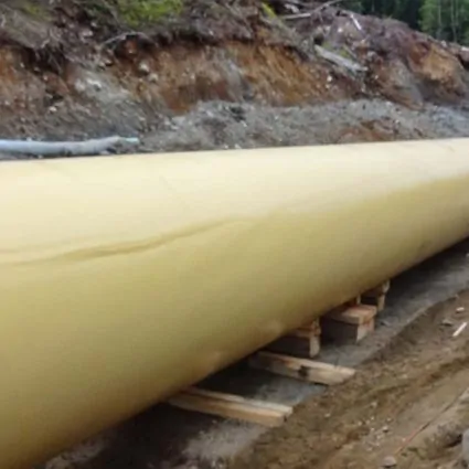 Field joint coating on a pipeline going into ground